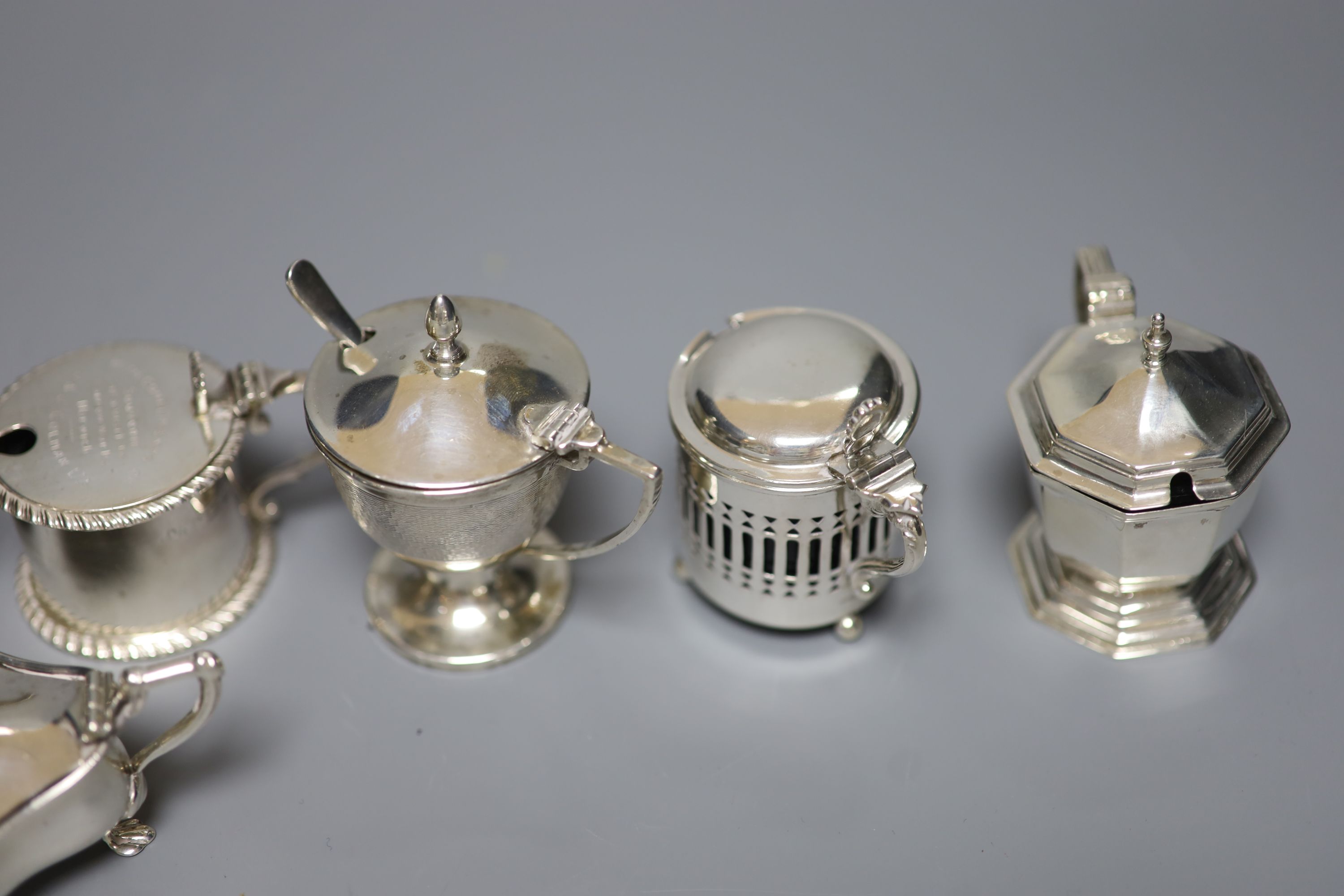 A J & J Colman Ltd presentation cylindrical silver mustard, inscribed to top and seven other silver mustards, various, 11.5oz